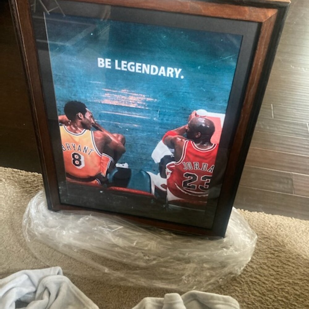 Micheal Jordan and Kolby Bryant talking on the bench Legends